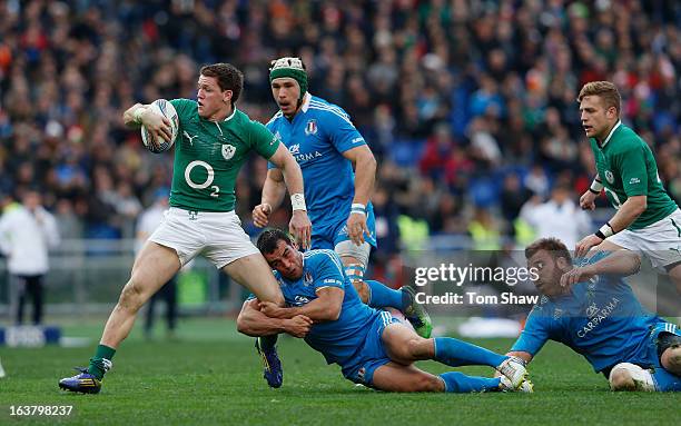 Craig Gilroy of Ireland is tackled during the RBX Six Nations match between Italy and Ireland at Stadio Olimpico on March 16, 2013 in Rome, Italy.