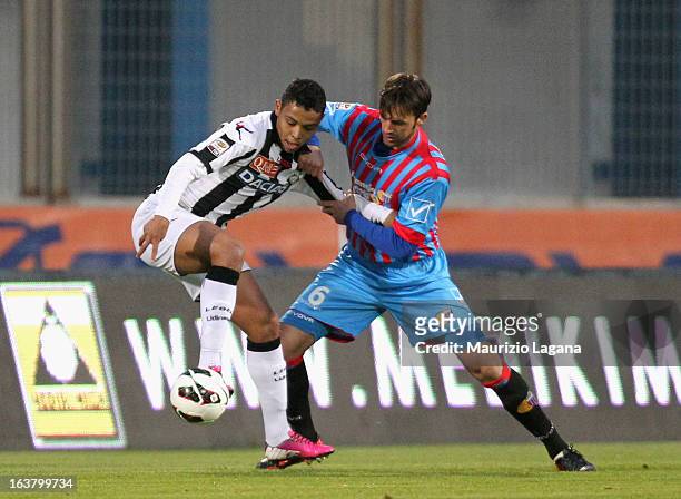 Nicola Legrottaglie of Catania competes for the ball with Luis Muriel of Udinese during the Serie A match between Calcio Catania and Udinese Calcio...
