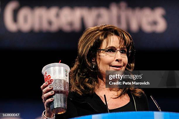 Sarah Palin, former Governor of Alaska, holds up a large soda as she speaks about New York City Mayor Michael Bloomberg's proposed large soda ban, at...