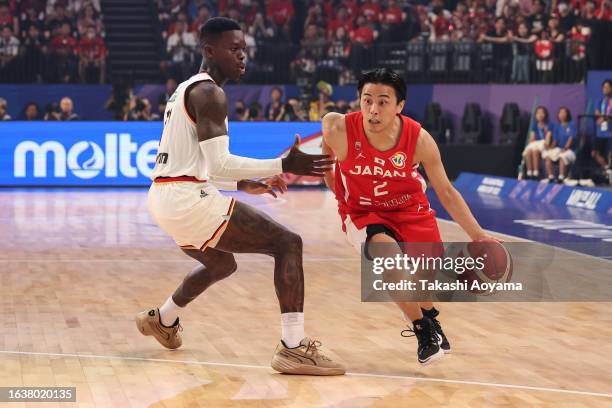 Yuki Togashi of Japan drives to the basket against Dennis Schroder of Germany during the FIBA World Cup Group E game between Germany and Japan at...