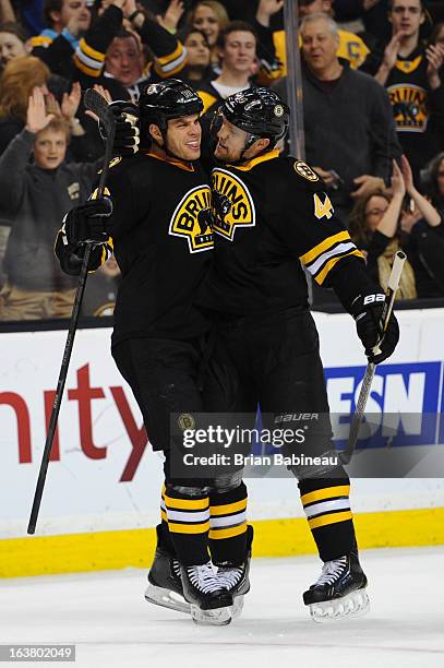 Nathan Horton and Dennis Seidenberg of the Boston Bruins celebrate a goal against the Washington Capitals at the TD Garden on March 16, 2013 in...