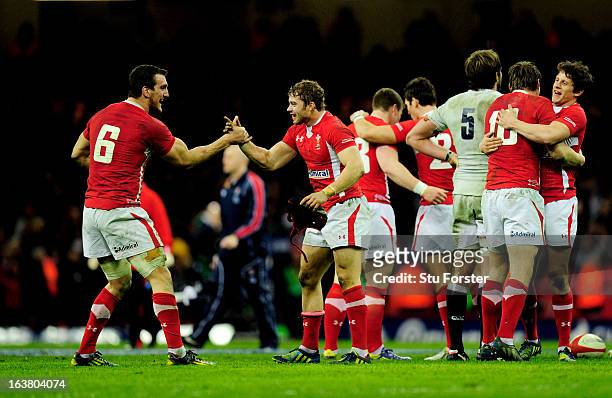 Wales teammates Sam Warburton and Leigh Halfpenny celebrate winning the Six Nations championship as the final whistle blows during the RBS Six...