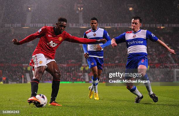 Nicky Shorey of Reading competes with Danny Welbeck of Manchester United during the Barclays Premier League match between Manchester United and...