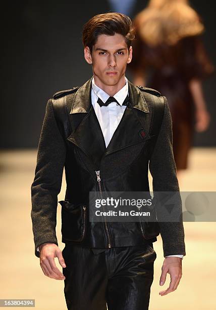 Model walks the runway during the Best of Mercedes-Benz Fashion Week Istanbul Fall/Winter 2013/14 at Antrepo 3 on March 16, 2013 in Istanbul, Turkey.