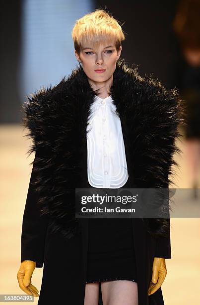 Model walks the runway during the Best of Mercedes-Benz Fashion Week Istanbul Fall/Winter 2013/14 at Antrepo 3 on March 16, 2013 in Istanbul, Turkey.