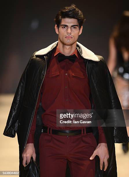 Model walks the runway during the Best of Mercedes-Benz Fashion Week Istanbul Fall/Winter 2013/14 at Antrepo 3 on March 16, 2013 in Istanbul, Turkey.