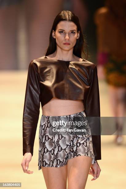 Model walks the runway during the Best of Mercedes-Benz Fashion Week Istanbul Fall/Winter 2013/14 at Antrepo 3 on March 16, 2013 in Istanbul, Turkey.