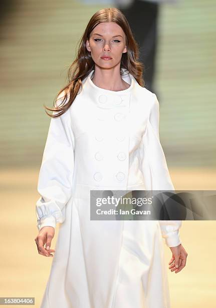 Model walks the runway during the Best of Mercedes-Benz Fashion Week Istanbul Fall/Winter 2013/14 at Antrepo 3 on March 16, 2013 in Istanbul, Turkey.