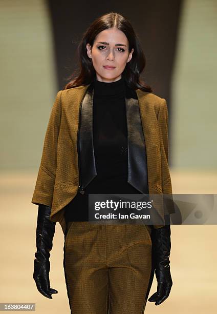 Model walks the runway during the Best of Mercedes-Benz Fashion Week Istanbul Fall/Winter 2013/14 at Antrepo 3 on March 16, 2013 in Istanbul, Turkey.