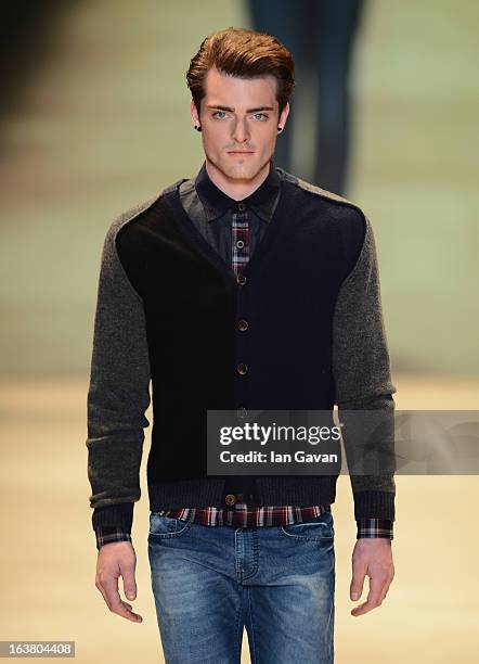 Model walks the runway during the Best of Mercedes-Benz Fashion Week Istanbul Fall/Winter 2013/14 at Antrepo 3 on March 16, 2013 in Istanbul, Turkey.