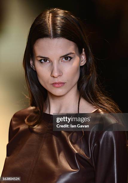 Model walks the runway during the Best of Mercedes-Benz Fashion Week Istanbul Fall/Winter 2013/14 at Antrepo 3 on March 16, 2013 in Istanbul, Turkey.