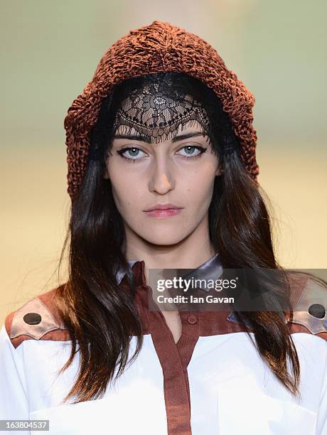 Model walks the runway during the Best of Mercedes-Benz Fashion Week Istanbul Fall/Winter 2013/14 at Antrepo 3 on March 16, 2013 in Istanbul, Turkey.