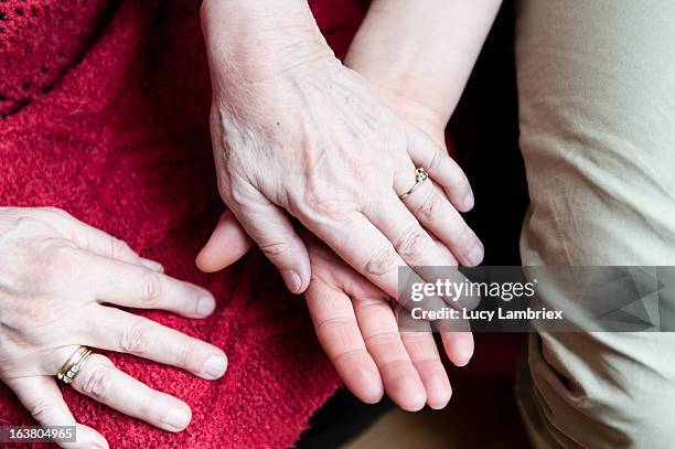 old hands, young hand - old woman young man fotografías e imágenes de stock