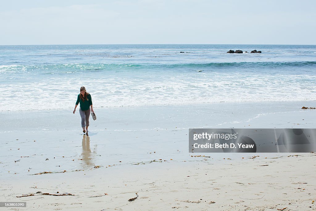 Teenage Girl Walking on the Beach