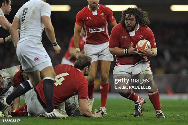 Wales's prop Adam Jones runs with the ball during the Six Nations international rugby union match between Wales and England at the Millennium Stadium...