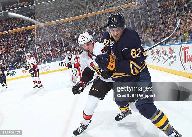 Patrick Wiercioch of the Ottawa Senators battles for the puck with Marcus Foligno of the Buffalo Sabres on March 16, 2013 at the First Niagara Center...