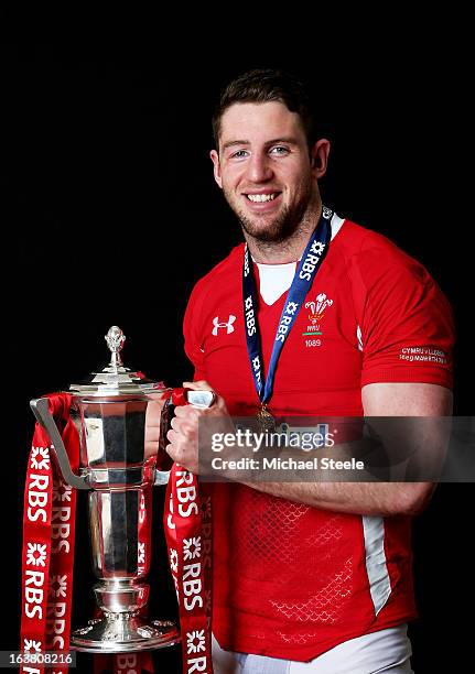 Wing Alex Cuthbert poses with the Six Nations trophy following his team's victory during the RBS Six Nations match between Wales and England at...