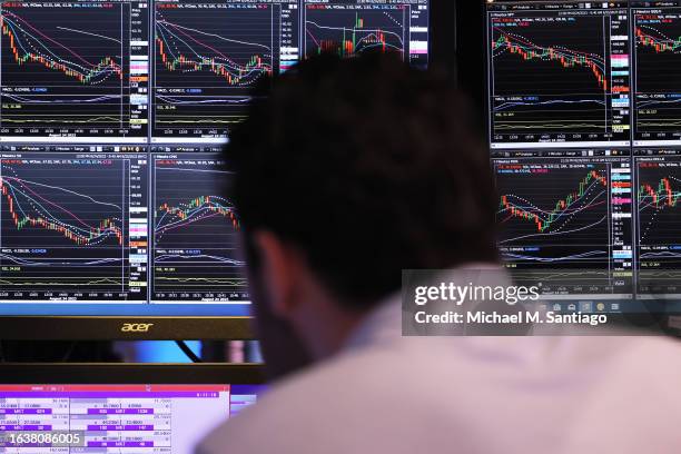 Traders work on the floor of the New York Stock Exchange during morning trading on August 25, 2023 in New York City. Stocks opened up higher as Wall...