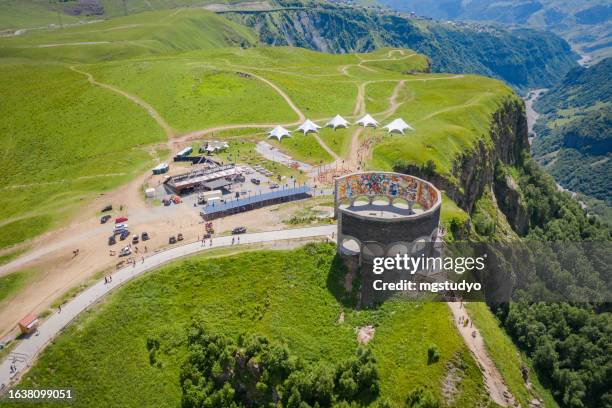 aerial view of soviet monument to russo-georgian friendship - gudauri stock pictures, royalty-free photos & images