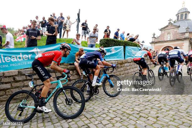 Clément Russo of France and Team Arkéa-Samsic, Johan Jacobs of Switzerland and Movistar Team, Arnaud De Lie of Belgium and Team Lotto Dstny compete...