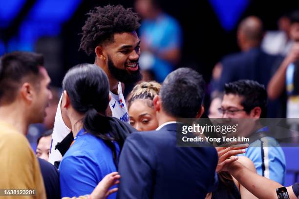 Karl-Anthony Towns of the Dominican Republic celebrates with family and friends after the FIBA World Cup Group A win over the Philippines at the...
