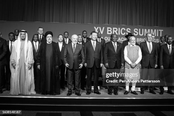 South African President Cyril Ramaphosa with fellow Brics leaders pose for a family photo with new Bric members at the last day of the Brics summit...