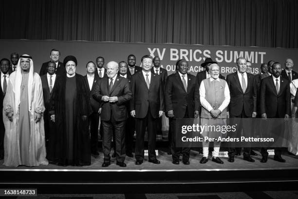 South African President Cyril Ramaphosa with fellow Brics leaders pose for a family photo with new Bric members at the last day of the Brics summit...