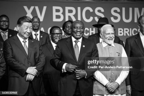 South African President Cyril Ramaphosa with fellow Brics leaders pose for a family photo with new Bric members at the last day of the Brics summit...