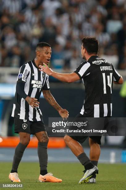 Gabriel Pires of Botafogo celebrates after scoring with teammate Danilo Neves during Copa CONMEBOL Sudamericana match between Botafogo and Defensa y...