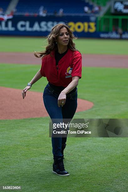 Lourdes Stephen, Univision Crrespondent and Host of "Sal y Pimiento" throws out the ceremonial first pitch before Pool 2, Game 6 between Team Puerto...
