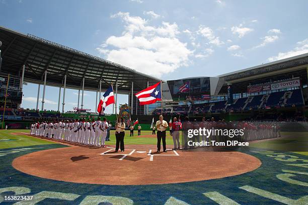 Players are seen on the field during the National Anthem before Pool 2, Game 6 between Team Puerto Rico and Team Dominican Republic in the second...