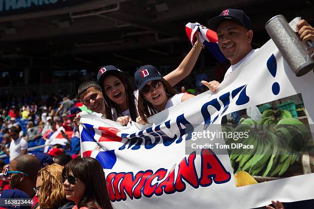 Dominican Republic fans celebrate during Pool 2, Game 6 against Team Puerto Rico in the second round of the 2013 World Baseball Classic on Saturday,...