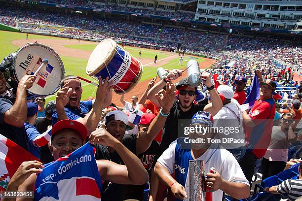 Dominican Republic fans celebrate during Pool 2, Game 6 against Team Puerto Rico in the second round of the 2013 World Baseball Classic on Saturday,...