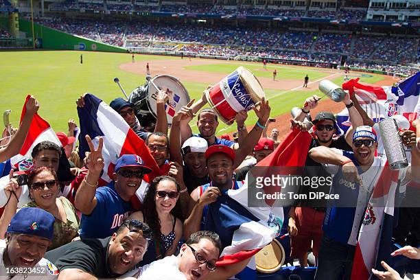 Dominican Republic fans celebrate during Pool 2, Game 6 against Team Puerto Rico in the second round of the 2013 World Baseball Classic on Saturday,...
