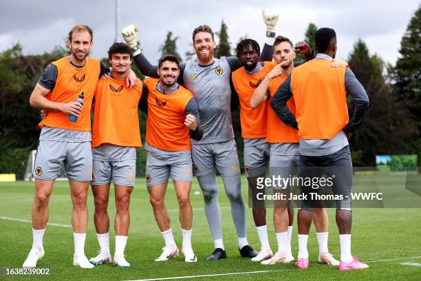 Craig Dawson, Hugo Bueno, Pedro Neto, Jose Sa, Boubacar Traore, Pablo Sarabia and Nelson Semedo of Wolverhampton Wanderers pose for a winning team...