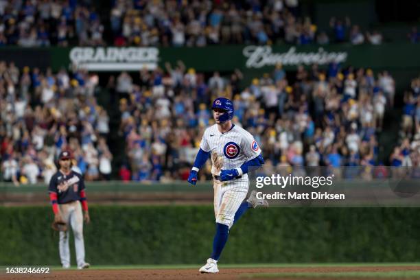 Nico Hoerner of the Chicago Cubs reacts while hitting a home run in a game against the Washington Nationals at Wrigley Field on July 19, 2023 in...