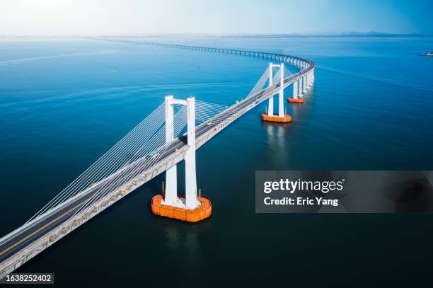 sea crossing bridge over blue sea - cable stayed bridge stock pictures, royalty-free photos & images