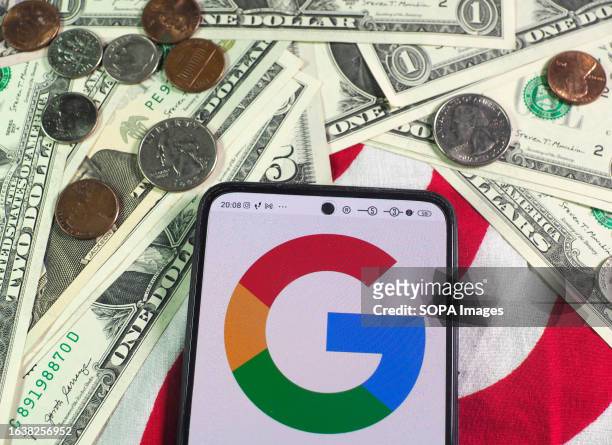 In this photo illustration, a Google logo is seen displayed on a smartphone and US currency notes and coins in the background.