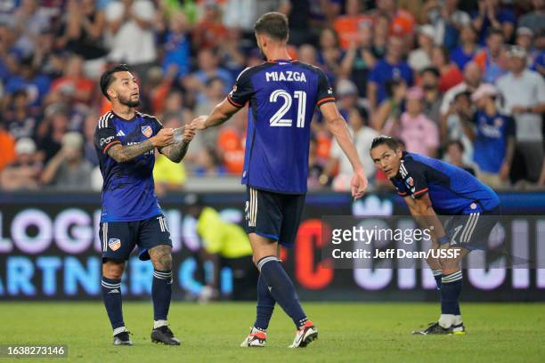 Luciano Acosta of FC Cincinnati gives the captain's armband to Matt Miazga during the second half of a U.S. Open Cup semifinal match against Inter...