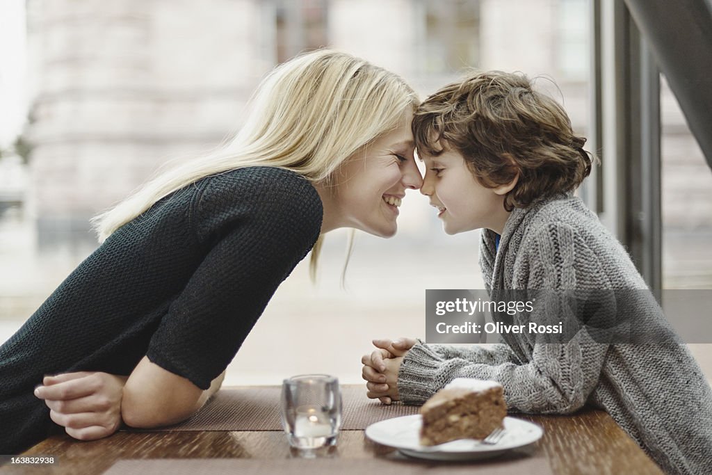 Mother and son head to head in a café