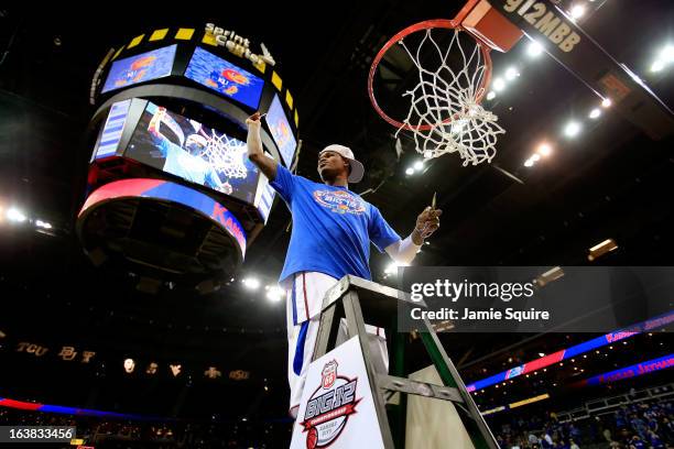 Ben McLemore of the Kansas Jayhawks cuts the net in celebration of their 70-54 victory over the Kansas State Wildcats during the Final of the Big 12...