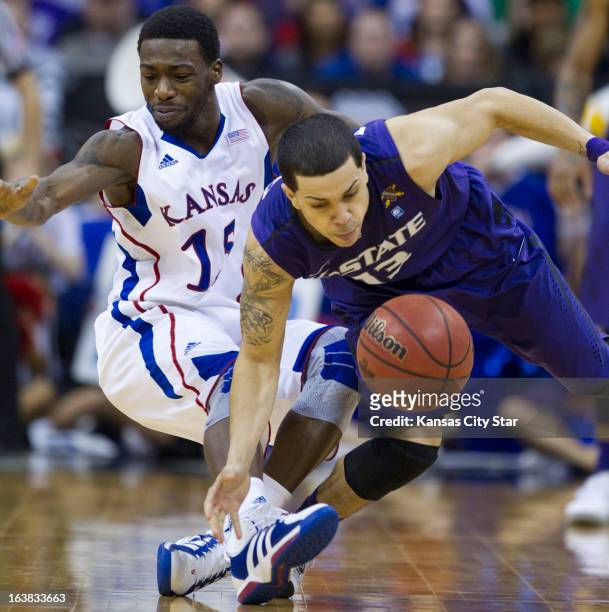 Kansas' Elijah Johnson tries to recover after Kansas State's guard Angel Rodriguez knocked the ball away in the second half of Kansas' 70-54 triumph...