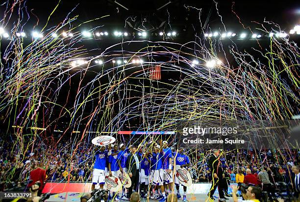 The Kansas Jayhawks and head coach Bill Self celebrate with the trophy after their 70-54 win over the Kansas State Wildcats during the Final of the...