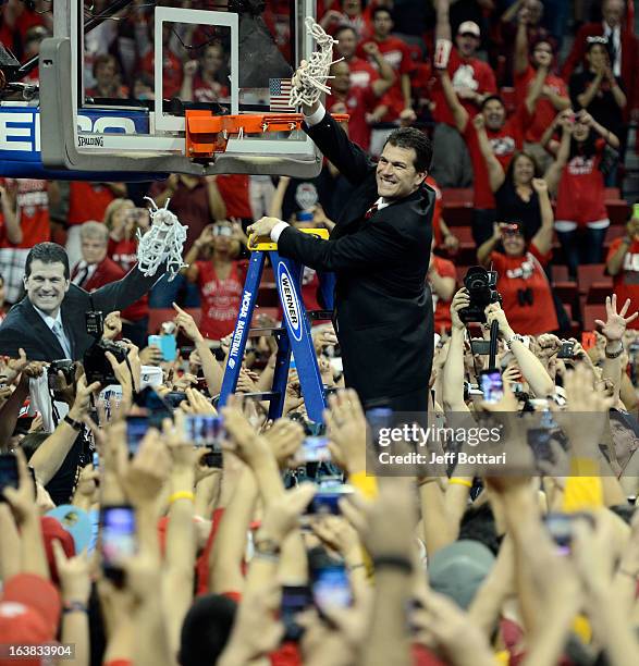 Head coach Steve Alford of the New Mexico Lobos cuts down the net after defeating the UNLV Rebels 63-56 to win the the championship game of the...