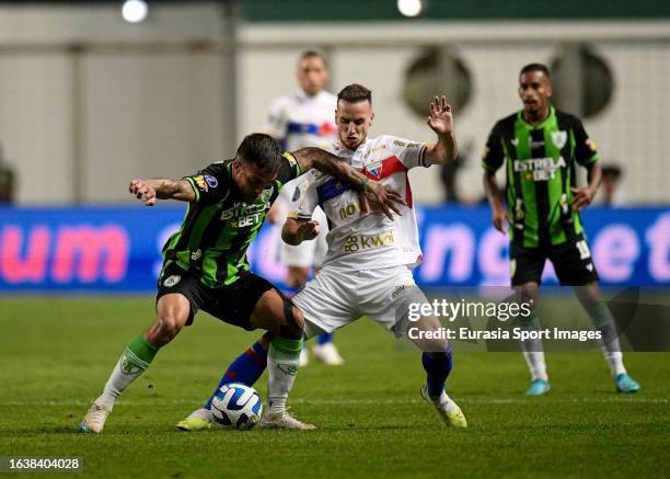 Javier Méndez of America fights for the ball with Tomas Pochettino of Fortaleza during Copa CONMEBOL Sudamericana match between America and Fortaleza...