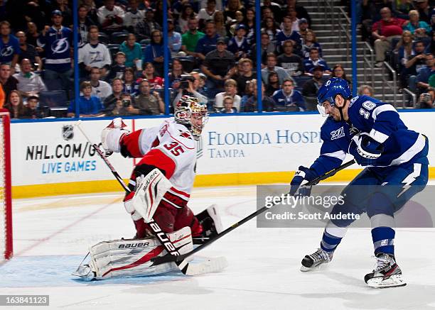 Teddy Purcell of the Tampa Bay Lightning scores on a break away during the third period of the game against the Carolina Hurricanes at the Tampa Bay...