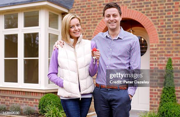 young couple with new home - wembley stadium celebrates topping of the new arches stockfoto's en -beelden