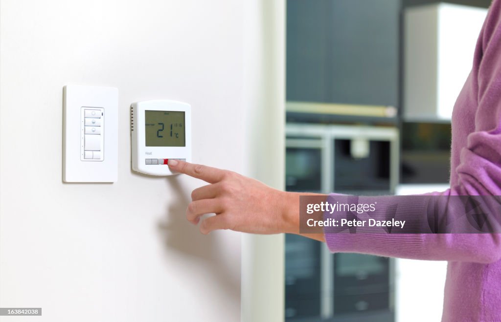 Young woman changing heating