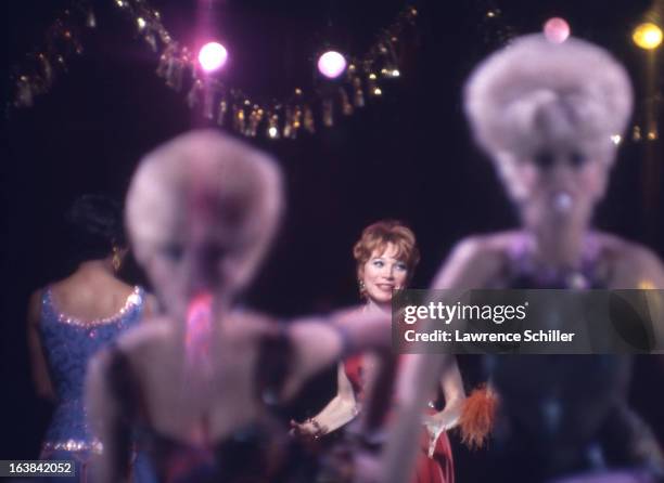 American actresses Paula Kelly and Shirley MacLaine perform with unidentified others in a scene from the film 'Sweet Charity' at Universal Studios,...