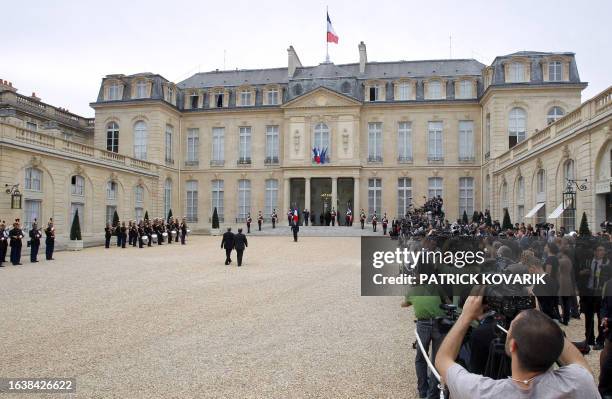 Reporters film the arrival in the courtyard of the Elysee palace of Mustafa Abdel Jalil, head of the rebels National Transitional Council and Mahmud...